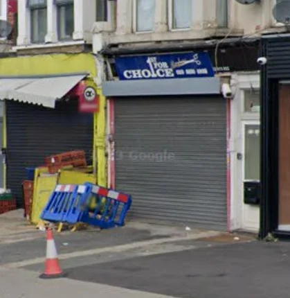 1st For Choice Barbers on Brownhill Road: the blue fascia with scissors logo above the shopfront