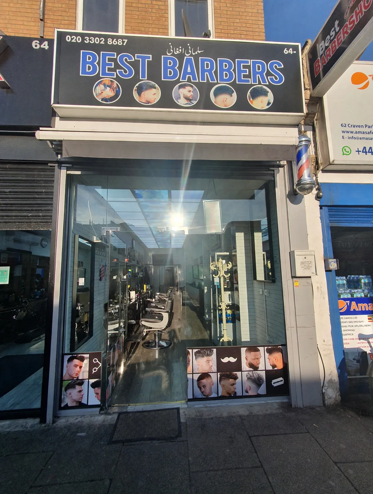 Best Barbershop on Craven Park Road: the blue BEST BARBERS sign with its phone number, the barber pole and the all-glass frontage