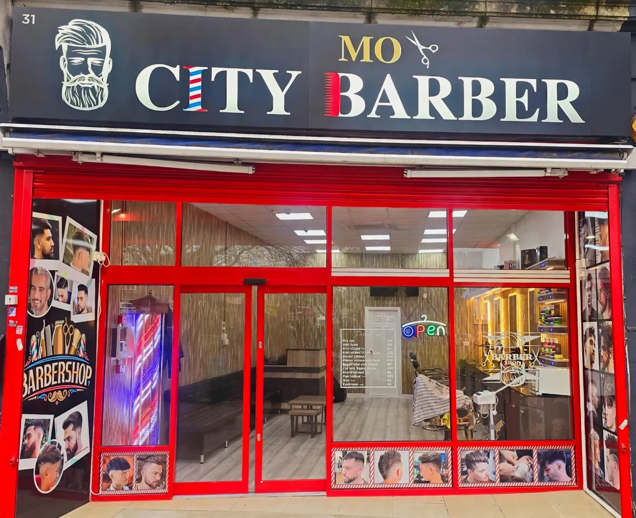 MO City Barber shopfront with red frames and printed portrait panels