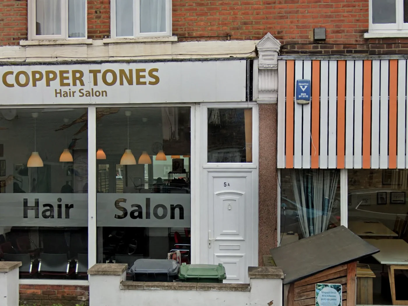 Coppertones at 5 Coppermill Lane: the COPPER TONES Hair Salon fascia in gold letters, white door marked 5A and Hair Salon lettering on the windows