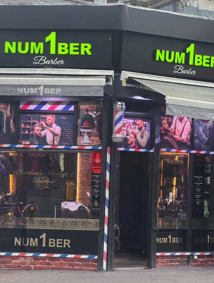 NUM1BER Barber shopfront with lime-green signage and price boards