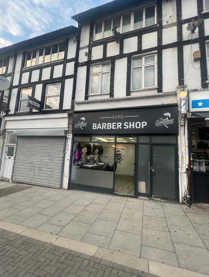 Rama Barber Shop frontage under the Tudor-style building